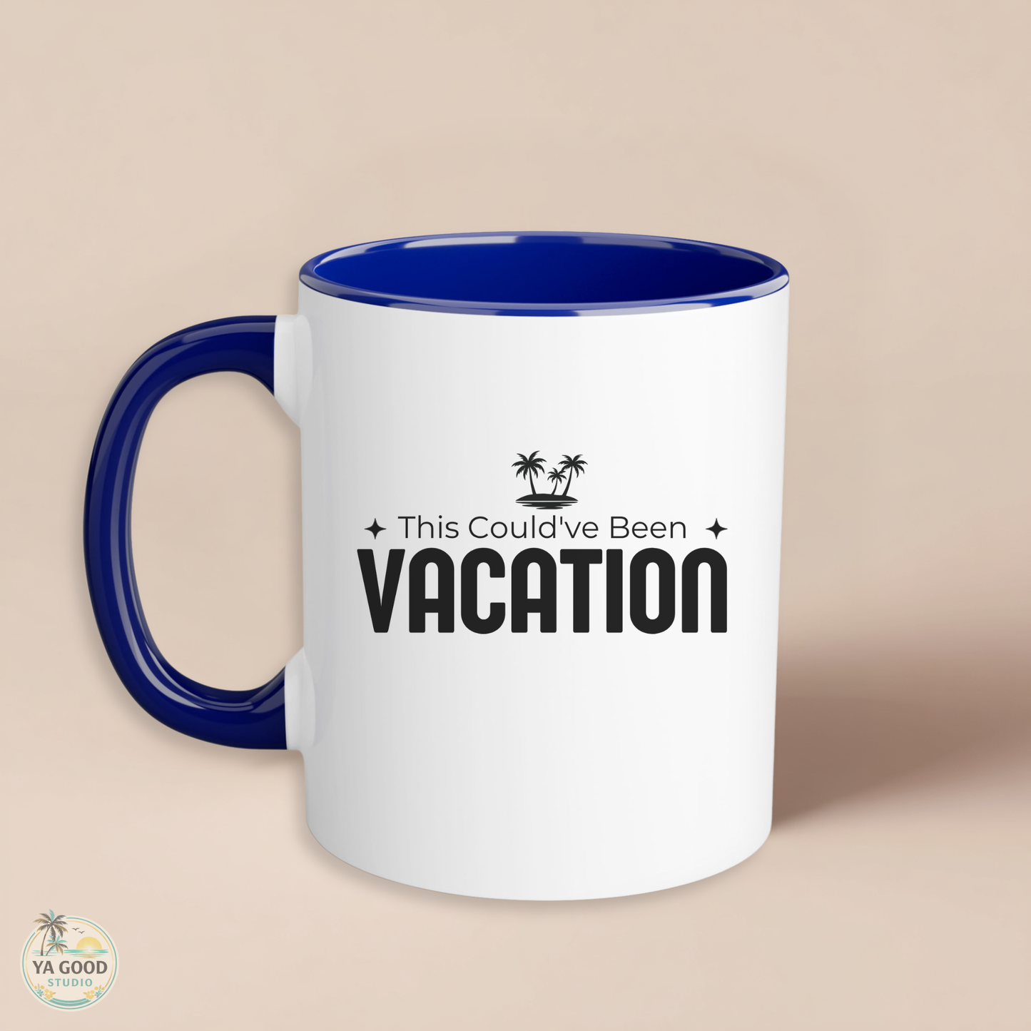 White mug with blue interior and handle, featuring 'This Could've Been Vacation' text on a beige background.