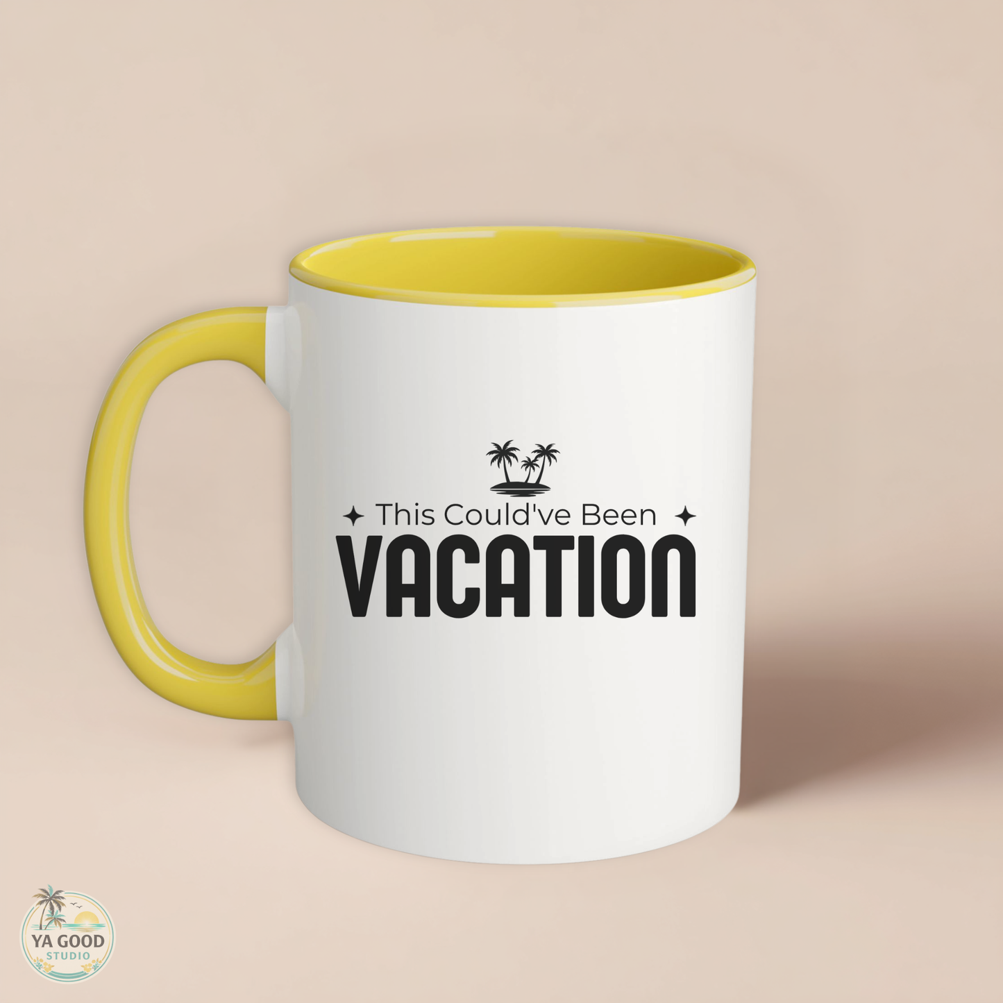 White mug with yellow interior and handle, featuring 'This Could've Been Vacation' text on a beige background.