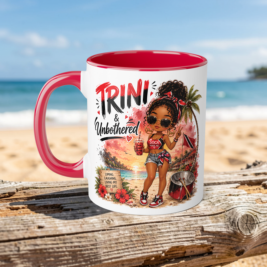 Mug with a design of a woman on a beach, featuring the text 'Trini & Unbothered', with a red interior and handle.