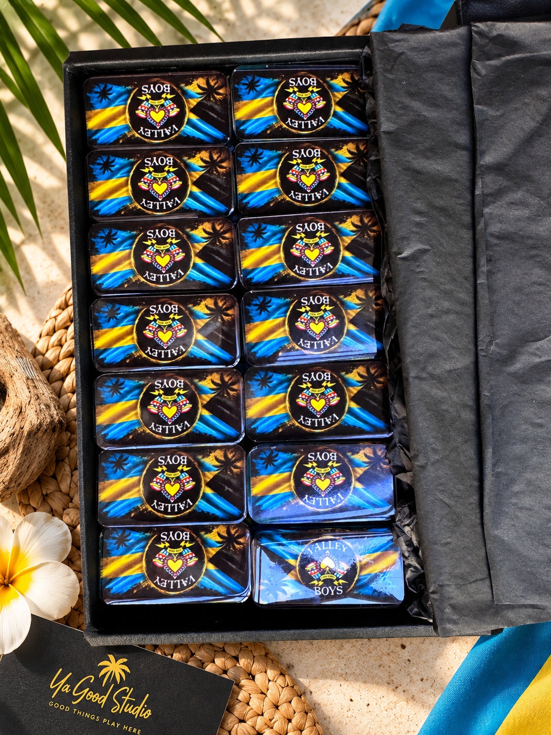 Custom resin domino set in black presentation box with Junkanoo-inspired artwork