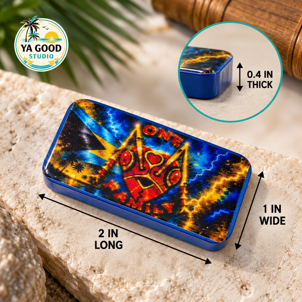 Close-up of a handmade resin domino showing detailed Junkanoo artwork and glossy finish